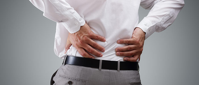 man holding back in back pain